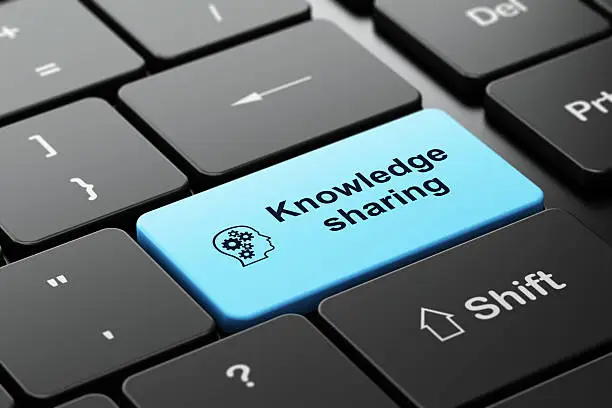 Photo of Education concept: Head Gears and Knowledge Sharing on keyboard