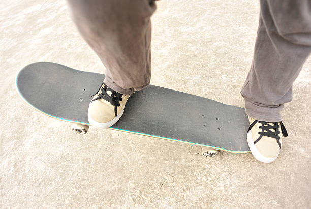 istock Legs in sneakers on a skateboard 467211041