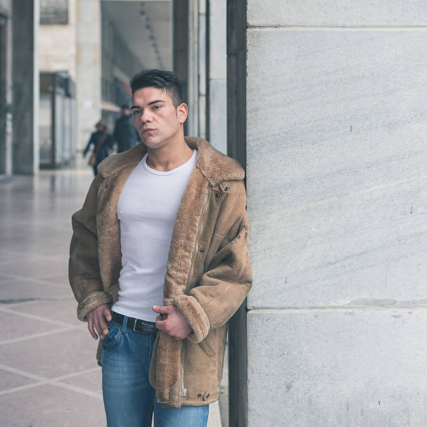 istock Young handsome man posing in the city streets 467212396