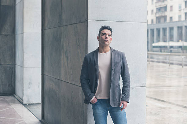 istock Young handsome man posing in the city streets 467212410
