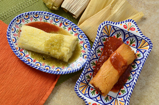 Mexican Tamales Traditional Mexican tamales, one with sweet corn, cheese and chili peppers, and one with shredded beef and tomatoes. tomatillo photos stock pictures, royalty-free photos & images