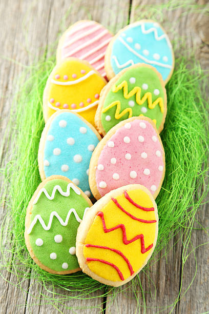 istock Colorful easter cookies on grey wooden background 467212922