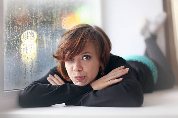 fun sexy girl lying on the windowsill