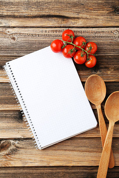 istock Open blank recipe book on brown wooden background 467219894