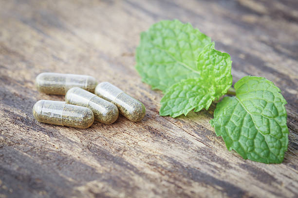 istock herbal medicine pills with mint leaf 467220222
