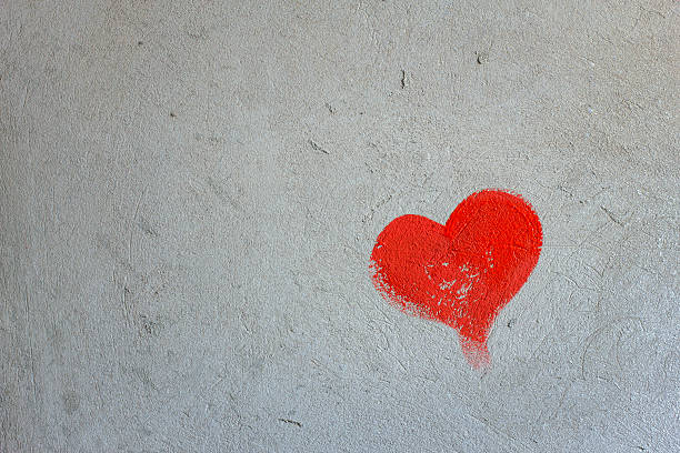 istock Red painted heart on a concrete wall 467223215