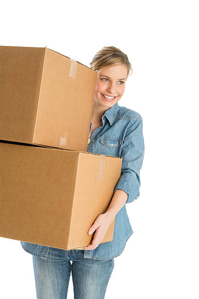 istock Woman Looking Away While Carrying Stacked Cardboard Boxes 467224205