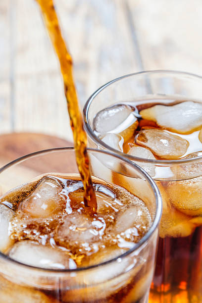 istock glass with ice cubes and cola 467224410