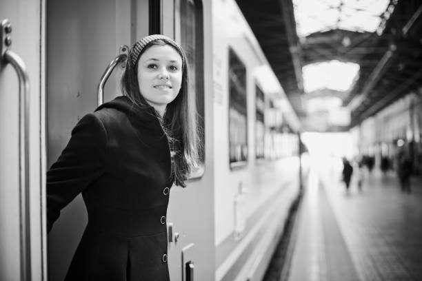 istock Happy young woman traveling with train 467225561