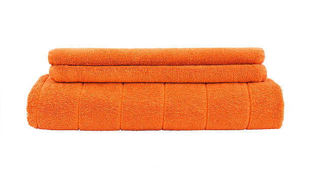 istock Orange towels isolated over white 467229038