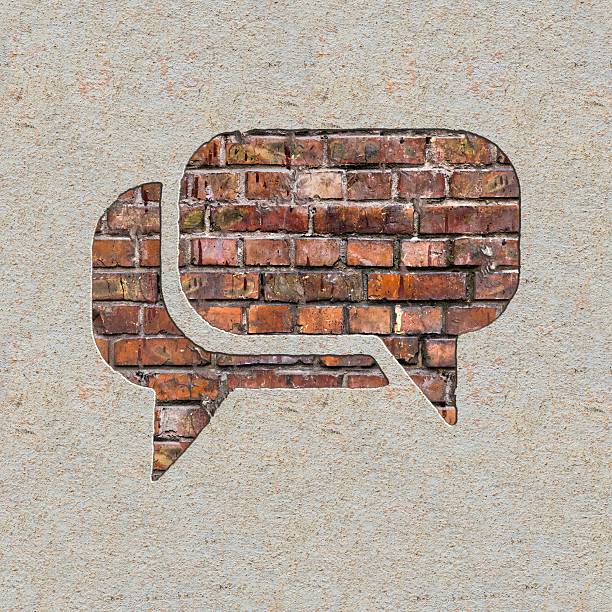 Speech Bubble Icon on the Wall. Speech Bubble Icon on the Brick and Plastered Wall. boundary stock pictures, royalty-free photos & images