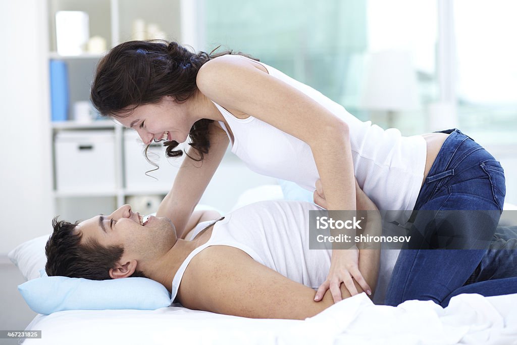 Couple at bed Young people flirting and having fun at bed Adult Stock Photo