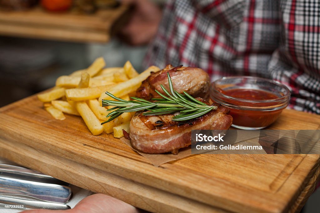 Bacon Wrapped Filet Waiter with Bacon Wrapped Filet  2015 Stock Photo