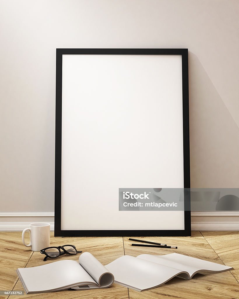 Work space with blank canvas, coffee, glasses, books,  mock up posters frames and canvas in loft interior background 2015 Stock Photo