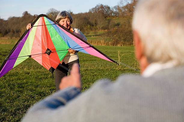 istock Senior couple flying kite 467232898