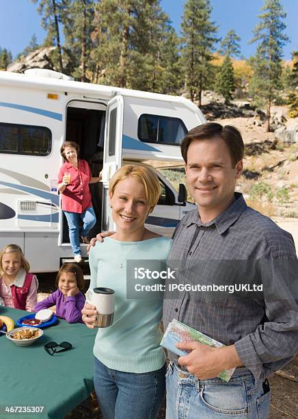 Couple On Vacation With Family Stock Photo - Download Image Now - Family, Motor Home, Camping