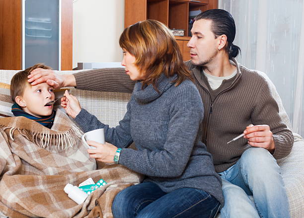 istock Parents and son with thermometer 467236023