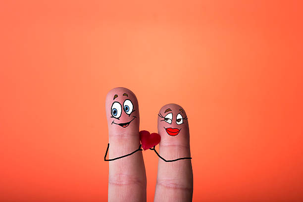 istock happy couple in love with painted smiley and hugging 467236681