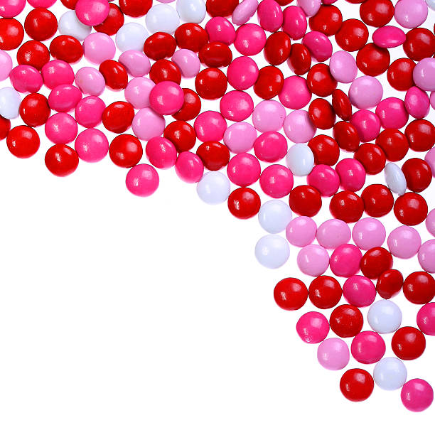 istock Chocolate Valentine's candy coated in pink, red and white isolated 467237697