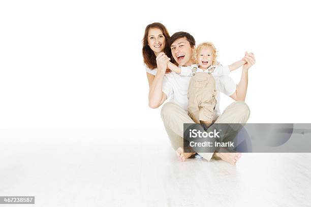 Happy Family Smiling Father Mother And Laughting Baby Stock Photo - Download Image Now