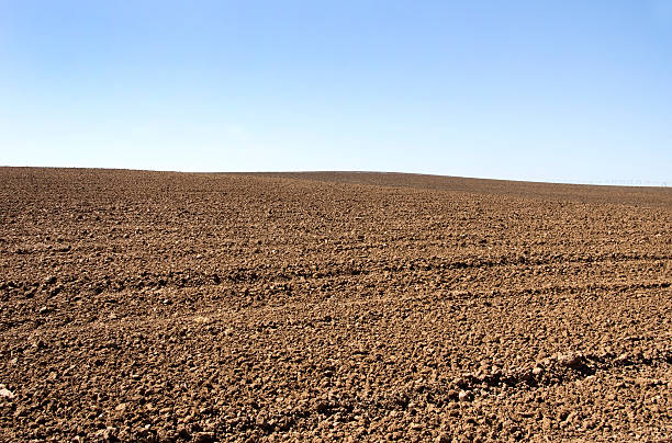 istock Agricultural plow soil and blue sky 467242002