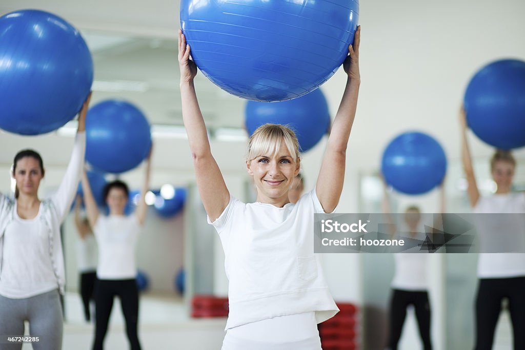 Exercising with balls Group of people exercising with fitness balls. Active Lifestyle Stock Photo