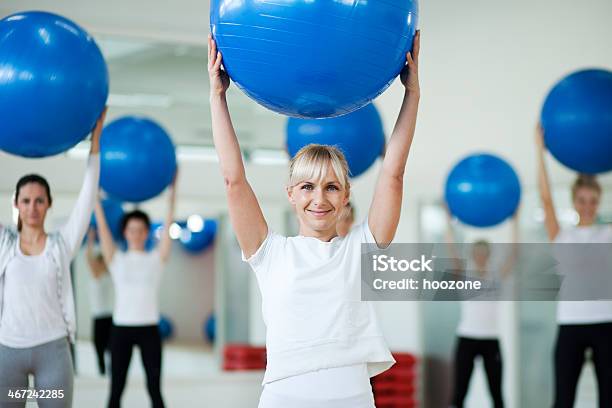 Exercising With Balls Stock Photo - Download Image Now - Active Lifestyle, Activity, Adult