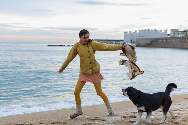 istock Woman plays with her dog 467242446
