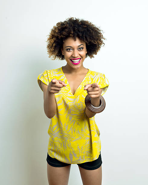 istock Cheerful Afro Young Woman pointing at camera 467245714
