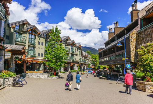 Whistler, British Columbia, Canada - June 10, 2013: Tourists ramble on the street of Whistler, co-host of the 2010 Olympic Games at June10, 2013. It is a Canadian resort town approximately 125 kilometres north of Vancouver.