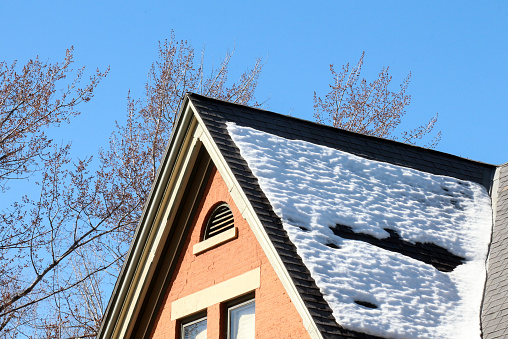 Snow melting off a roof