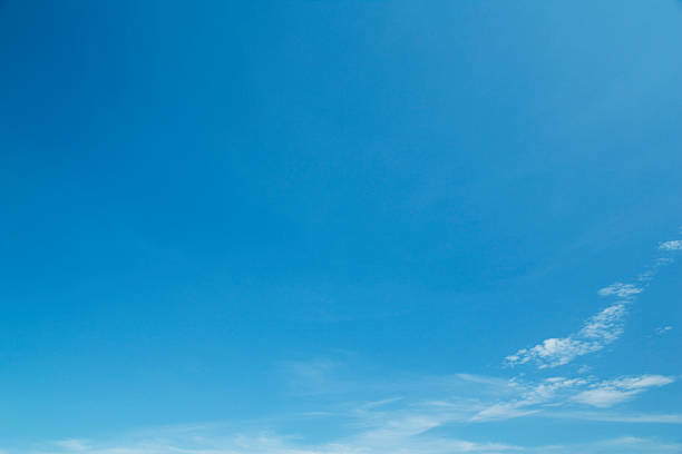 istock Background of a clear blue sky with a few wispy white clouds 467249191