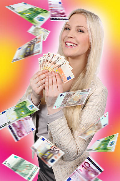 istock Woman with lots of banknotes 467252086