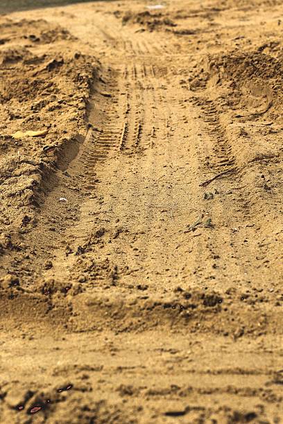 istock Wheel tracks on the soil. 467252410