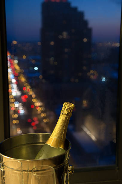 istock Celebrate! Champagne with Evening Cityscape 467252804