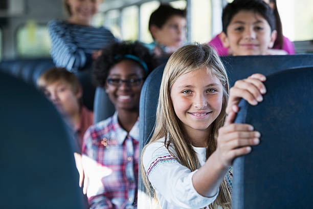 istock Children riding school bus 467253707