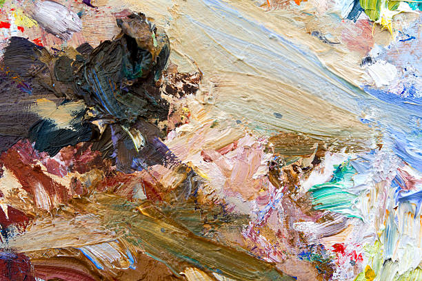 istock Oil paints palette vibrant multi-coloured full frame background close up 467254119