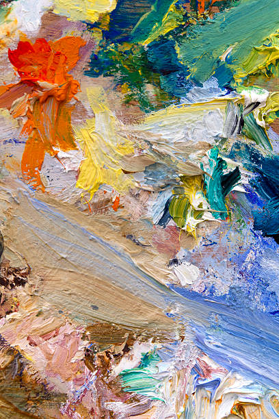 istock Oil paints palette vibrant multi-coloured full frame background close up 467254123