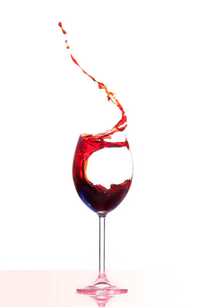 red wine splash stock photo