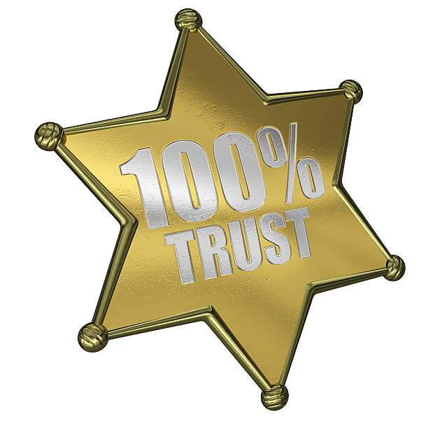 sheriff star 100% trust - in gold we trust stock-fotos und bilder