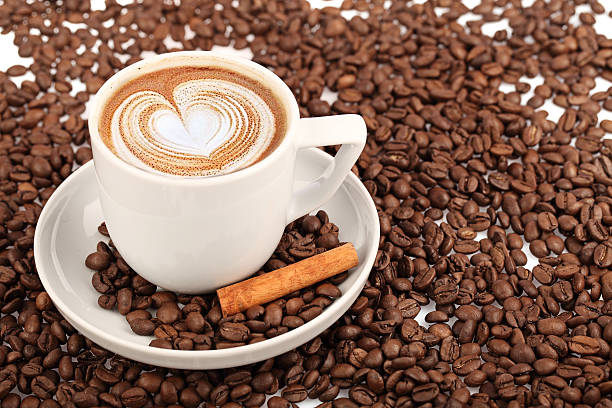 istock Coffee cup and beans on a white background. studio 467256634