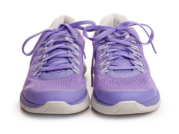 Purple female sport shoes stock photo