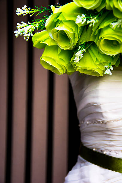 istock Wedding dress on a stand with green bouquet 467257704