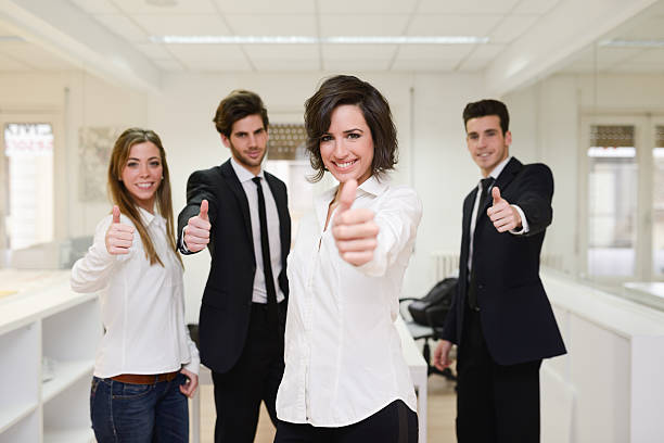 istock Cheerful business group giving thumbs up 467257849