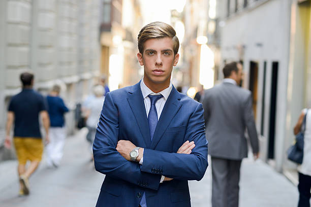 istock Attractive young businessman in urban background 467257891