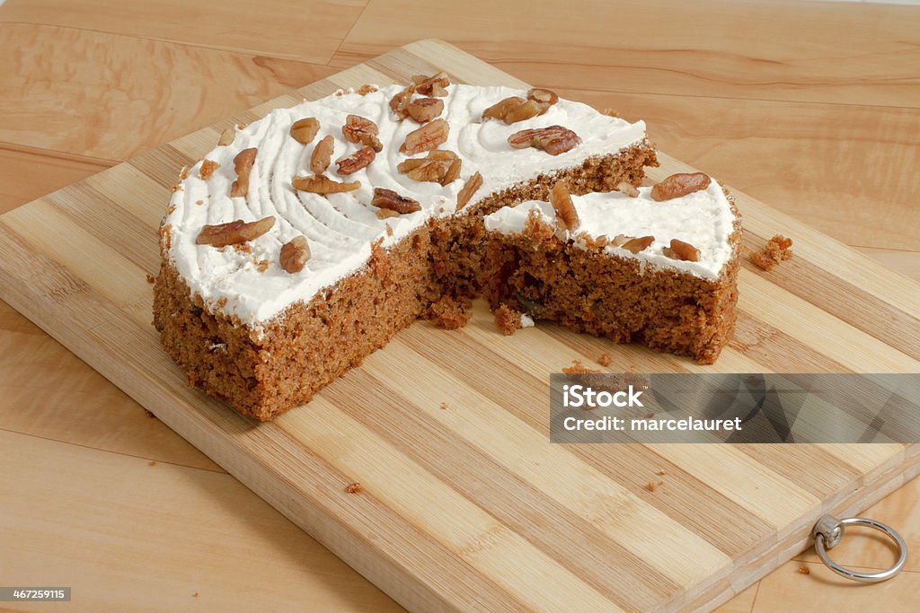 Carrot cake Sliced carrot cake on a wooden cutting board Baked Pastry Item Stock Photo