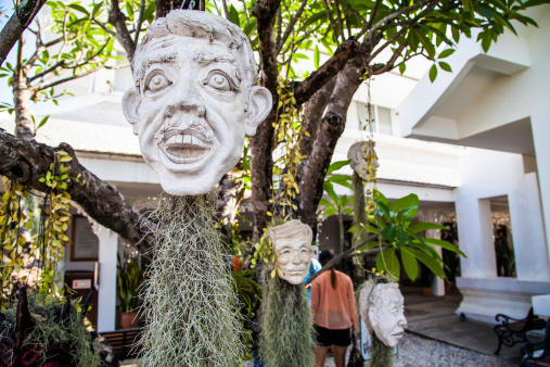 Chiang Rai, Thailand - May 5, 2013: Sculpture of face at the White temple named Wat Rong Khun in Chiang Rai, Thailand.