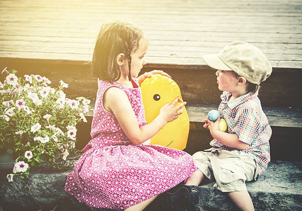 istock Boy and Girl Playing with Toy Easter Chick - Retro 467262440