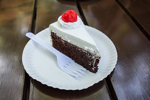 istock Slice of chocolate cake on wood background 467262742