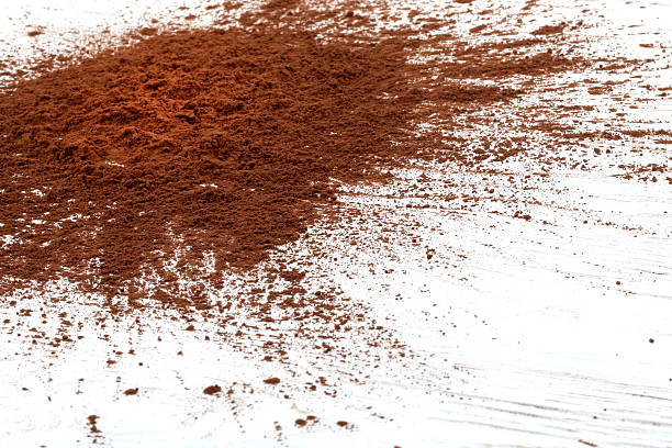 istock Sprinkled cocoa powder on wood table 467262762
